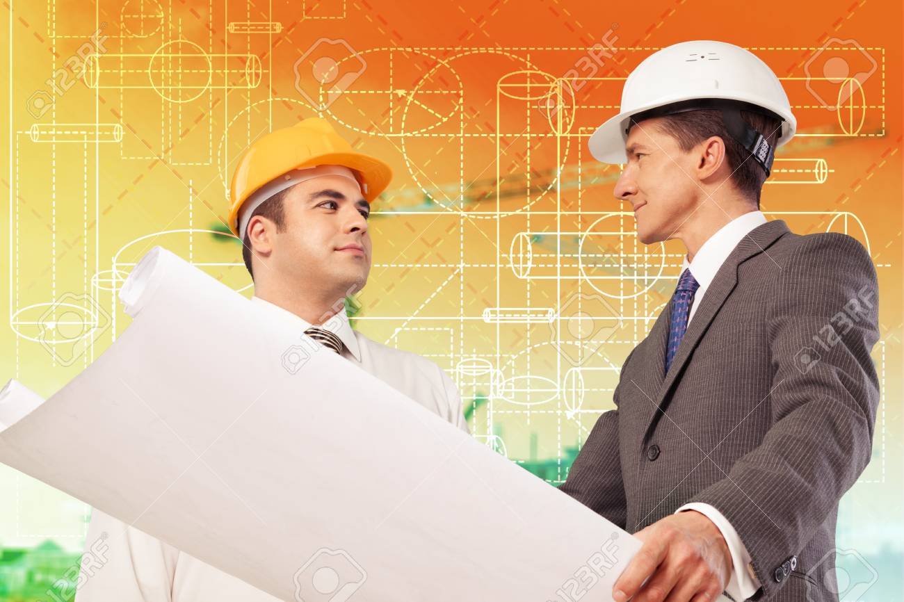 architect and supervisor Reviewing Blueprints